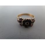 A 9ct gold and garnet ring size O/P - approx weight 2.