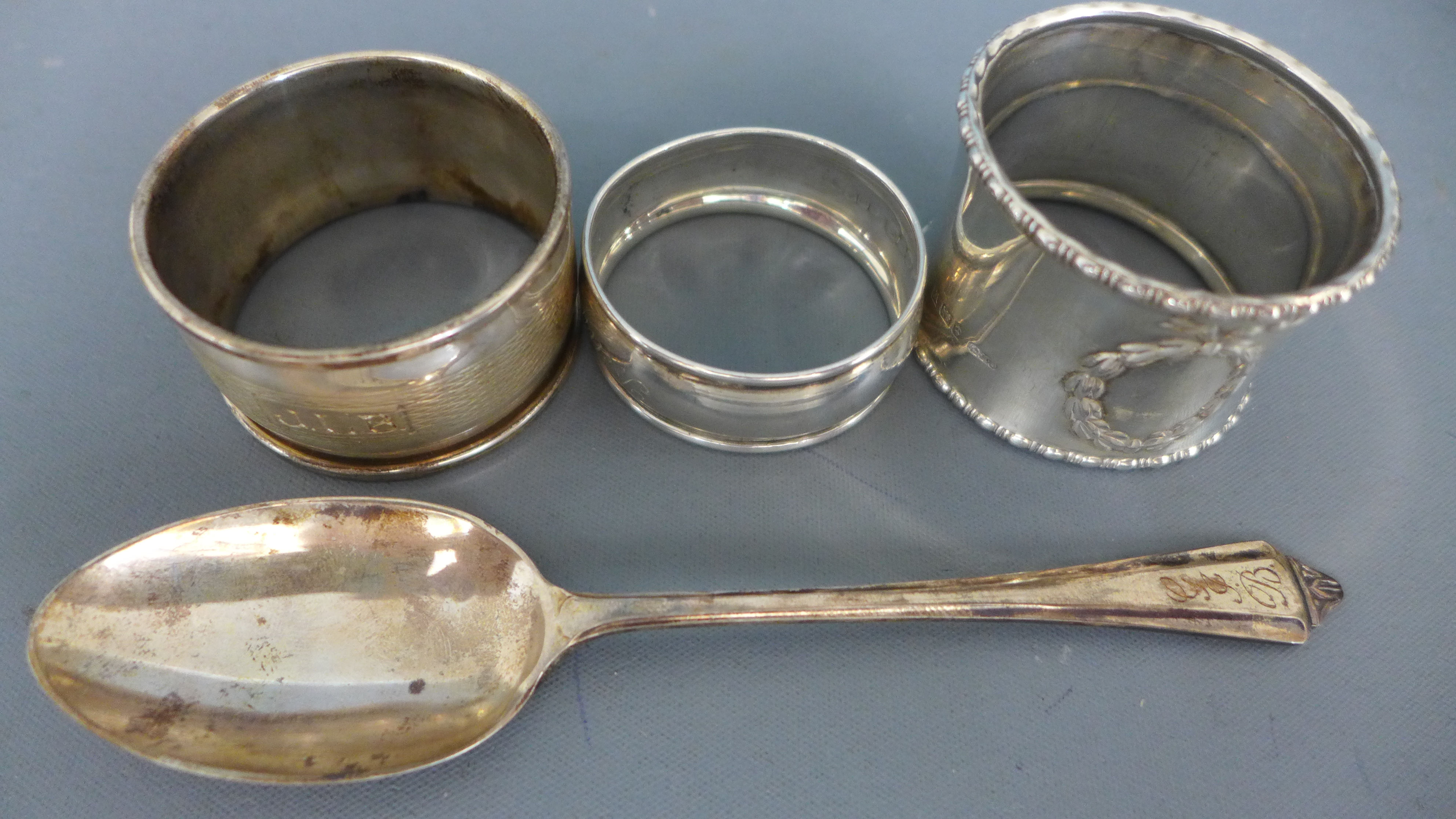 Three silver hallmarked napkin rings and a silver hallmarked teaspoon - approx weight 1. - Image 2 of 2