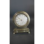 A small silver cased bedside clock - Height 7.