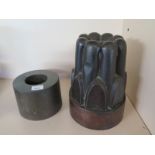 A 19th century copper jelly mould Height 23cm - and a cylinder mould - some small dents but no