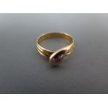 A 15ct yellow gold ring in the form of a snake with ruby eye - ring size M - approx weight 2.