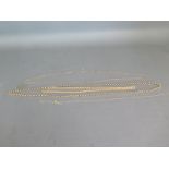 Four 9ct yellow gold chains the largest being approx 72cm in length - approx weight 38 grams - one
