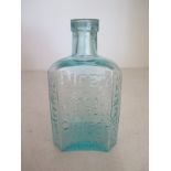 A small size Dicey and Co Daffys Elixir glass bottle - Aqua-blue colour - Height 12.