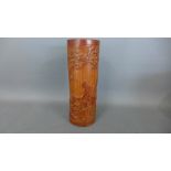 An Oriental carved bamboo brush pot,