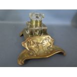 An Art Nouveau brass cast inkwell,