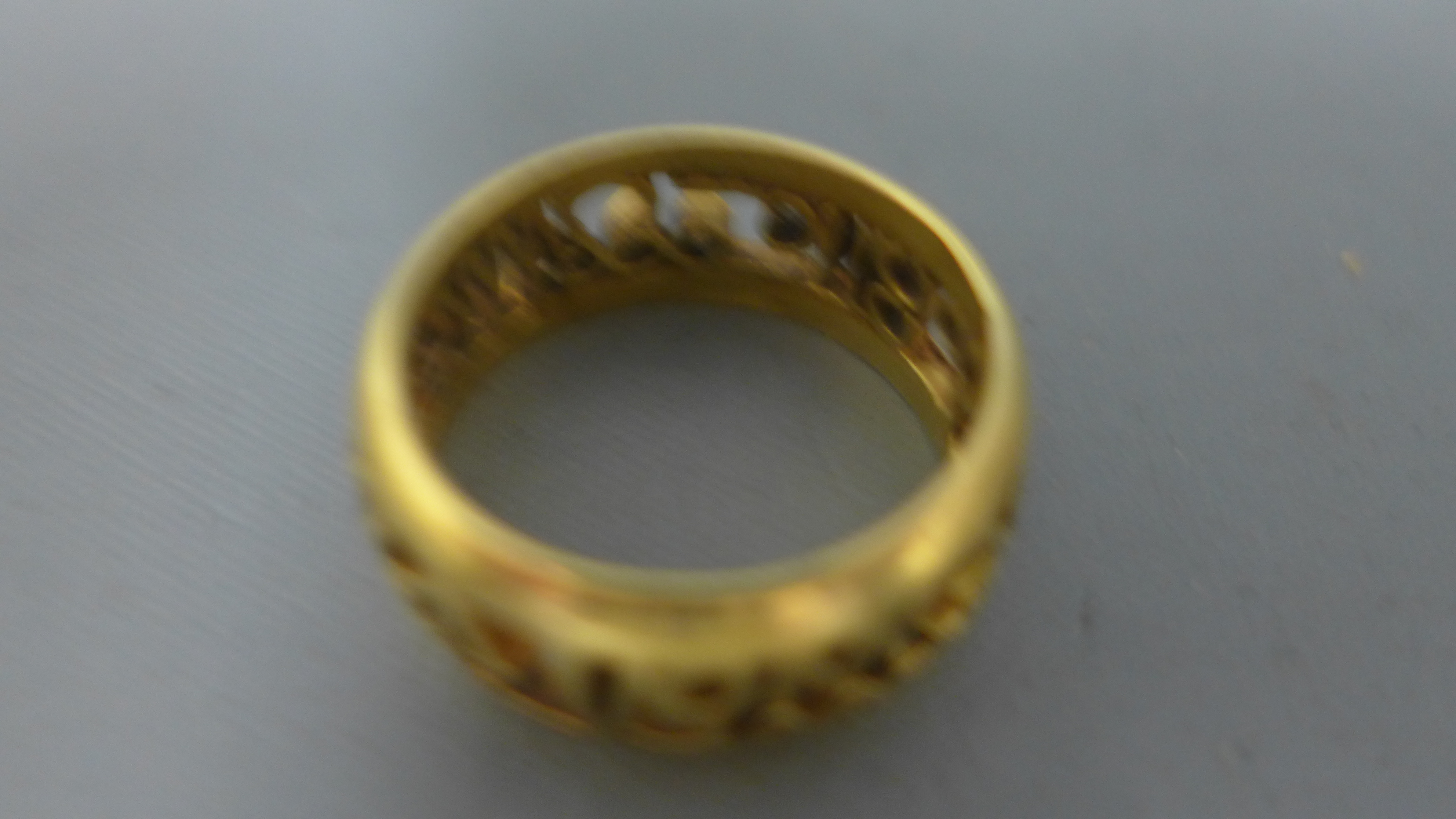 A 9ct yellow gold ring with pierced decoration to centre - approx weight 8. - Image 2 of 2