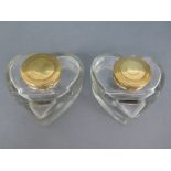 A pair of heart shaped glass inkwells with brass hinged lids - no damage evident