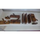 A selection of wooden woodworking planes approx ten in total - varying condition
