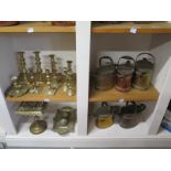 A collection of copper and brass ware to include trivet desk stand,