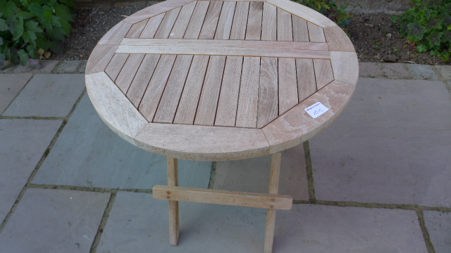 A teak folding table