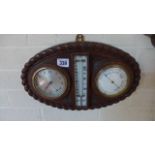 An oak cased rope twist clock/barometer and thermometer