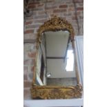 A giltwood framed mirror - Height 100cm x Width 45cm