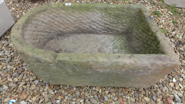 A carved stone planter - Height 28cm x 68cm x 43cm