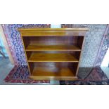 A modern yew reproduction three shelf bookcase - 101cm x 99cm x 32xcm