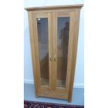 An oak two door display cabinet - slight damage to the top left corner - 180cm x 85cm