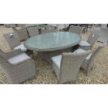 A Bramblecrest Oakridge 220cm elliptical table with two armchairs and four side chairs,