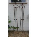 A pair of hand forged wrought iron triangular garden obelisks with scrolled finials - Height 229cm