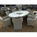 A Bramblecrest Biscay oval dining table with eight armchairs, lazy susan,