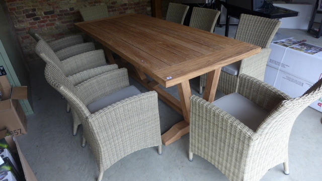 A Bramblecrest Kuta 240cm rectangular table with eight armchairs