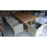 A Bramblecrest Kuta 240cm rectangular table with eight armchairs