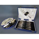 A boxed set of silver cake forks,