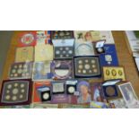 A collection of proof and uncirculated British coins including silver proof £5 coin,