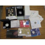 A collection of four fine silver coins, two £20 coins, two Brittanias £2 and £50,