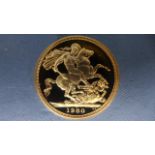 A gold full Sovereign coin dated 1980 in a case - good condition
