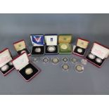 A collection of sixteen silver proof coins