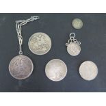 Two Victorian silver coins one with pendant mount and four other coins