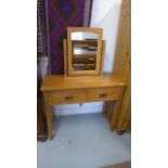 A modern light oak dressing table,