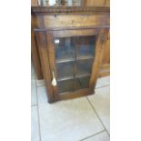 An antique style oak corner cupboard with a single glazed door - Height 98cm