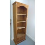 A tall reproduction pine open bookcase with two lower drawers - 184cm x 60cm - in very good