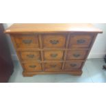 An antique style chest of nine drawers raised on bracket supports - 87cm x 34cm x Height 68cm