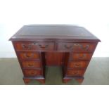 A modern desk with a leather inset top over eight drawers - Width 92cm x Height 76cm