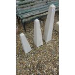 A set of three graduated limestone obelisks ranging from 44cm x 69cm