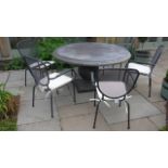 A Bramblecrest 140cm Venetian round concrete table with six mesh chairs and cushions