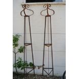 A pair of hand forged wrought iron triangular garden obelisks with scrolled finial's - Height 229cm