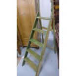 A 1930's five tread stepladder with original green and cream paint