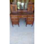 An Edwardian mahogany dressing table with an upstand above seven drawers - Height 124cm x 122cm x