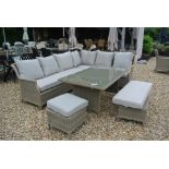 A Bramblecrest Oakridge casual dining set with dining table, sofas,