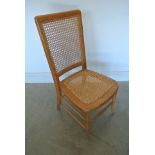 A beechwood caned nursing chair