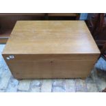 A late Victorian stripped pine box raised on small bun feet,