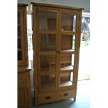 A Besp-oak Vancouver solid oak glazed bookcase with a drawer - Height 201cm x 98cm x 40cm