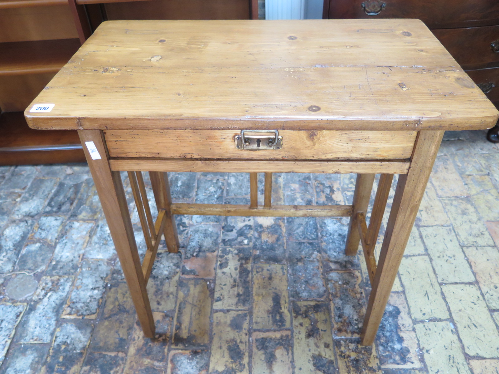 A stripped pine 19th century side table with single drawer mounted,