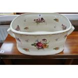 A floral decorated foot bath jardiniere