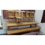 A large pine table - Height 78cm x 98cm x 260cm - with matching bench and six chairs - 2 + 4 - top
