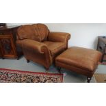 A Laura Ashley distressed leather armchair and stool with a lift up top