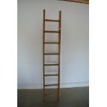 An eight rung wooden ladder - Stripped and waxed for decorative purposes - Height 214cm