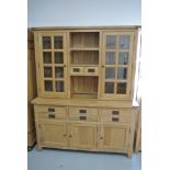 A Besp-oak Vancouver solid oak dresser with a glazed top above six drawers and three cupboard doors